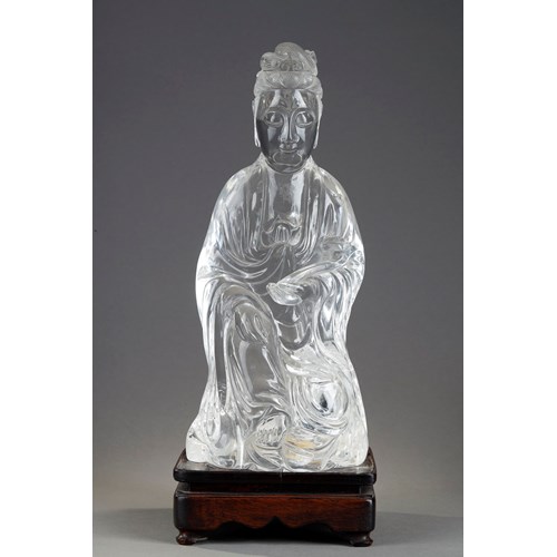 Large rock crystal figure representing a guanyin holding a sceptre